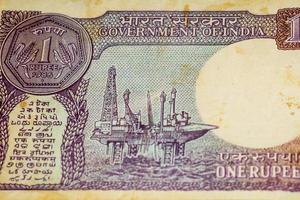 Old One Rupee notes combined on the table, India money on the rotating table. Old Indian Currency notes on a rotating table, Indian Currency on the table photo