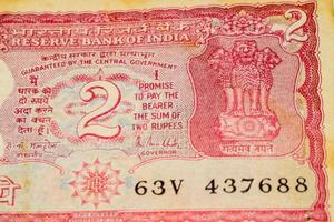 Old Two Rupee notes combined on the table, India money on the rotating table. Old Indian Currency notes on a rotating table, Indian Currency on the table photo