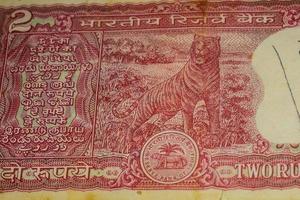 Old Two Rupee notes combined on the table, India money on the rotating table. Old Indian Currency notes on a rotating table, Indian Currency on the table photo