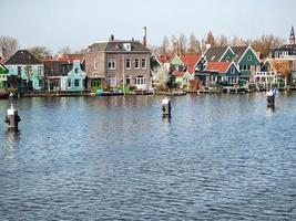 ancient house neat to the river by Zaanse Schans town in netherlands, travel reportage photo