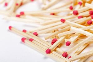 Wooden matches on the white background photo