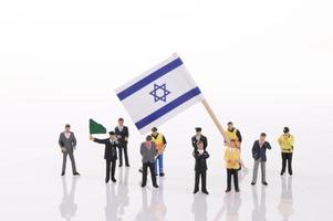 Miniature people with flag of Israel