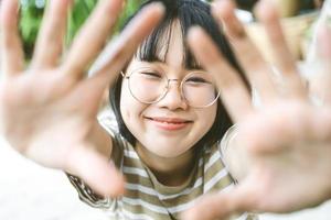 POV view portrait of young adult asian woman take a selfie photo. photo