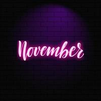 November. Neon glowing lettering on a brick wall background. Vector calligraphy illustration. Typography for banners, badges, postcard, tshirt, prints, posters.