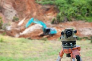 Surveyor equipment theodolite at construction site photo