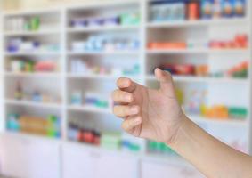 pharmacist hand holding something photo