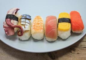 Maki Sushi set on wooden background photo