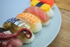 Maki Sushi set on wooden background photo