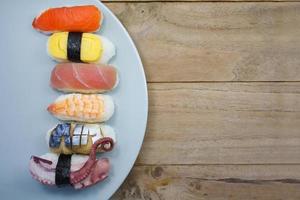 Maki Sushi set on wooden background photo