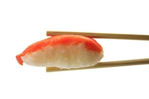 salmon sushi in chopsticks isolated on white background photo