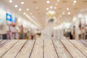 Empty table and blur clothing store with bokeh background photo