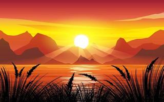 Dramatic sunset at lake with grass and mountains