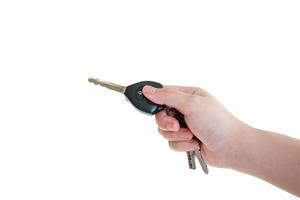 women's hand presses on the remote control car alarm systems photo