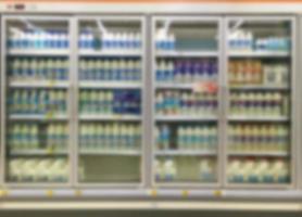 Commercial refrigerators in a large supermarket photo