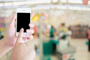 Supermarket store blur background ,Cashier counter with customer photo