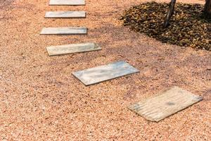 Zen stone path on gravel floor in the garden