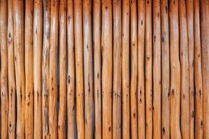 Brown old striped hardwood plank fence background photo