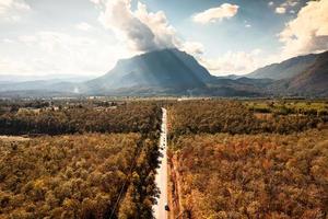 Aerial view of Doi Luang Chiang Dao mountain with the road among the autumn forest on bright day at Chiang Dao photo