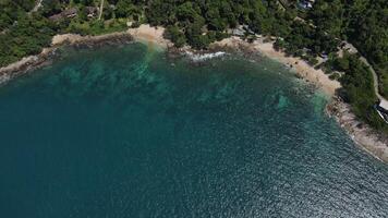 Aerial view of sand beach and water surface texture. Foamy waves with sky. Beautiful tropical beach. Amazing sandy coastline with white sea waves. Nature, seascape and summer concept. video