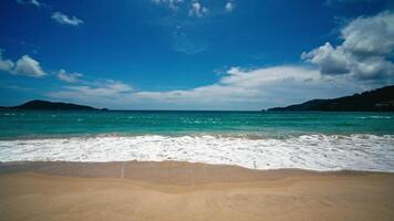 Beach space area. Foamy waves with sky and clouds. Beautiful tropical beach. Amazing sandy coastline with white sea waves. Nature, seascape and summer concept. video