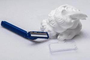 Shaving razor and foam photo