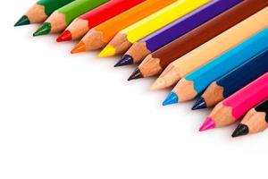 Multicolored pencils on white background photo