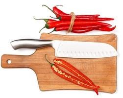 Chili pepper and knife photo