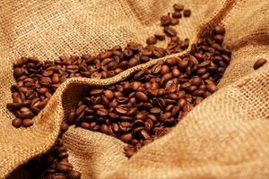 Coffee beans on sackcloth photo