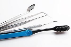 Dental tools on white background photo