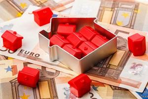 Small toy houses and money photo