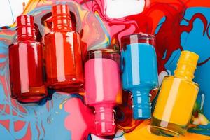 Bottles with spilled nail polish photo