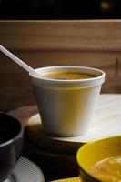 soup in a disposable cup front view photo