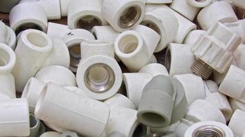 Many White Pvc Water Supply Pipe Fittings Close Up