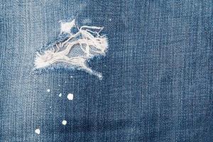 Jeans texutre with a hole photo