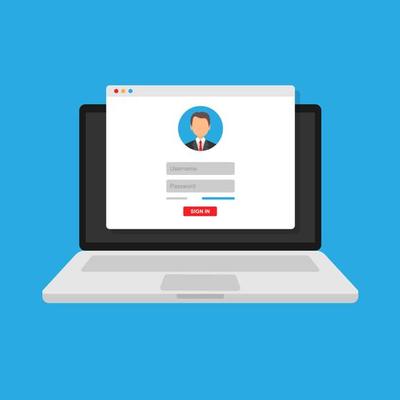 login form, the login page opens in a web browser window on the laptop screen.