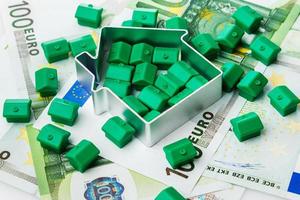 Small toy houses and money photo