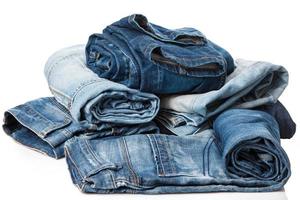 Stack of blue jeans photo