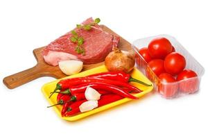 Raw meat and vegetables photo