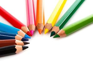 Multicolored pencils on white background photo