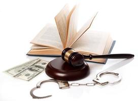 Gavel, books and handcuffs photo