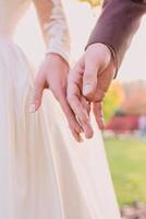 hands of wedding couple  in love. Relationship, love and tenderness concept photo