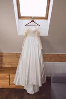 white wedding dress on the clothes hanger photo