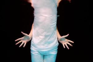 dancing hands underwater on black background in the swimming pool photo