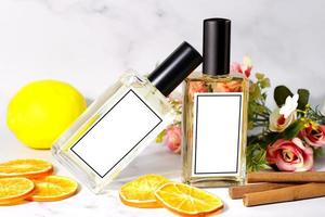 Two perfum bottles and spicy and fruits on white photo