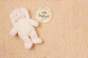 Baby card greeting with a toy, copy space photo