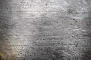 Stainless steel that has a scratching surface,brushed texture metal background. photo