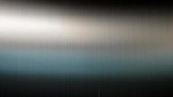 Reflection of light on a shiny metal texture,stainless steel background. photo