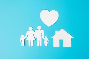 Happy Family day. paper shape cutout with Father, Mother, Children, Home and Heart. international day of families, Warm home, love, Insurance, Life and Wellness concepts. photo