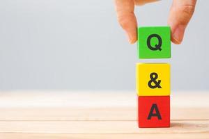 Q and A word with wooden cube block. FAQ, frequency asked questions, Answer, Question  Ask, Information, Communication and Brainstorming Concepts photo