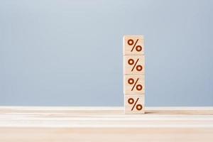 wood cube block with percentage symbol icon. Interest rate,  financial, ranking and mortgage rates concept photo